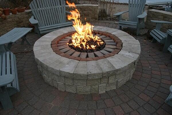 circular outdoor fire pit with brick and stone